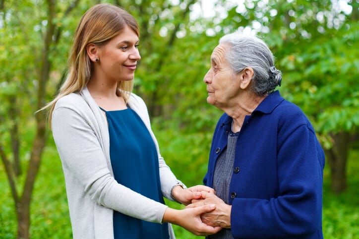 A PSW offering companionship and care to an elderly client