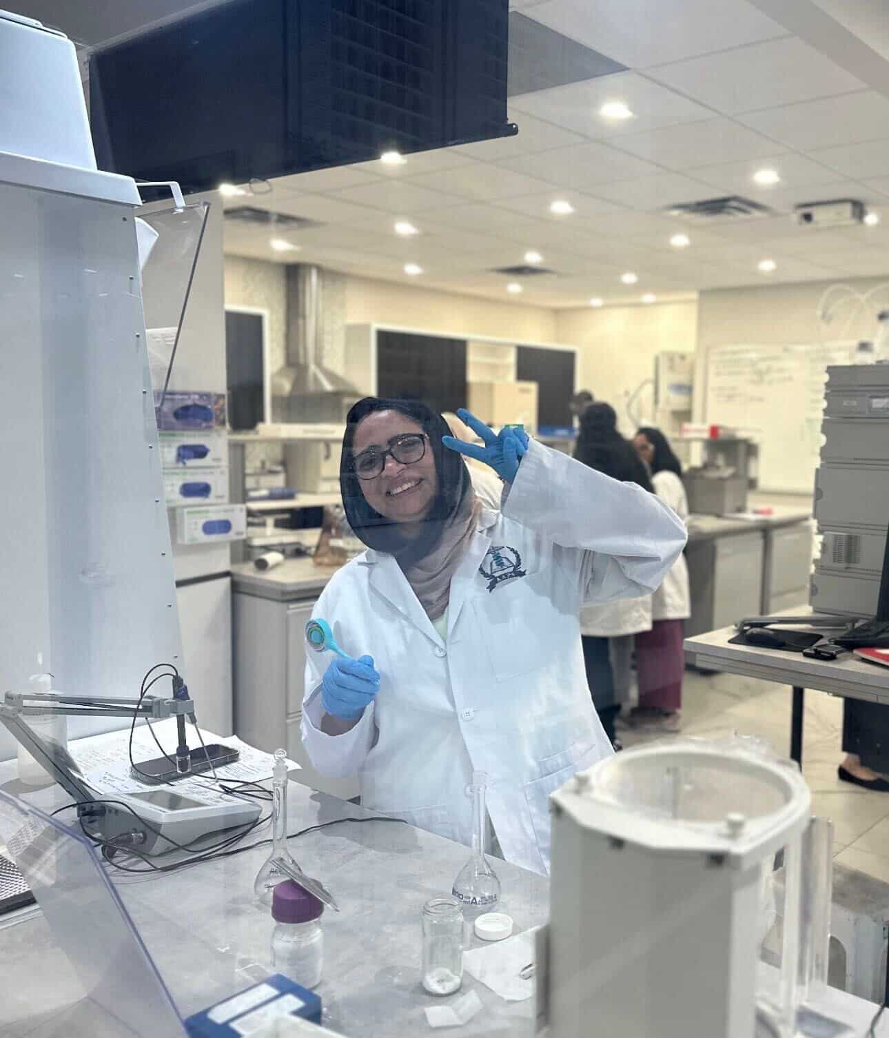 A pharmaceutical quality student practising GMP procedures in a simulated manufacturing lab