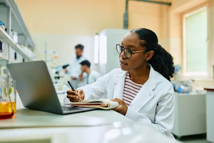 A student studying for a clinical research diploma