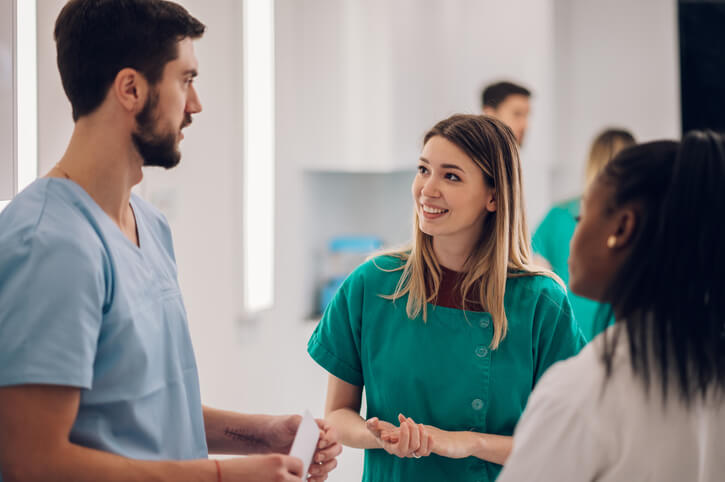 A Personal Support Worker Certificate graduate communicating with the healthcare team
