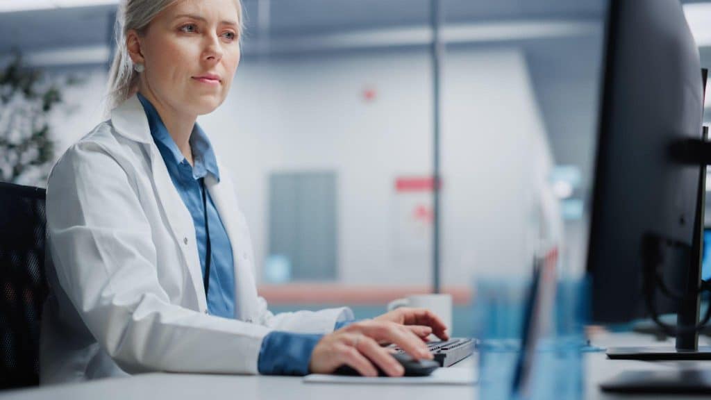 Clinical research coordinator maintaining digital TMF documentation