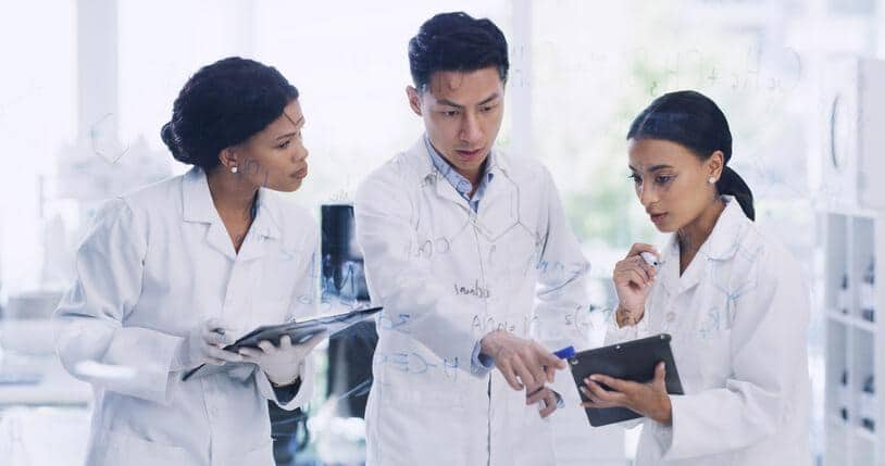 A clinical research team discussing study results during a clinical research certificate trial.