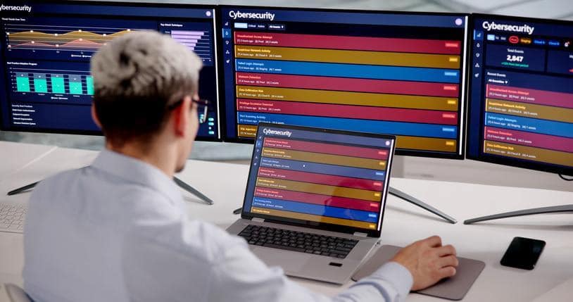A cybersecurity student reviewing security alerts in a SIEM platform