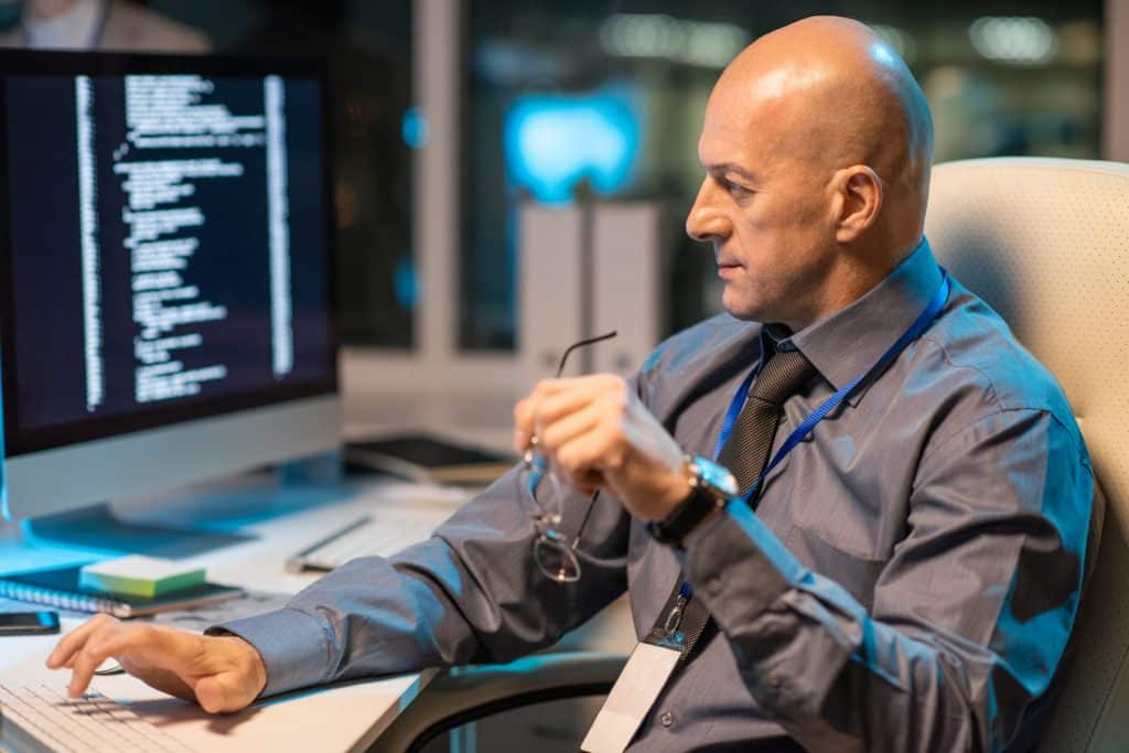 A security professional reviewing configuration evidence during a control assessment