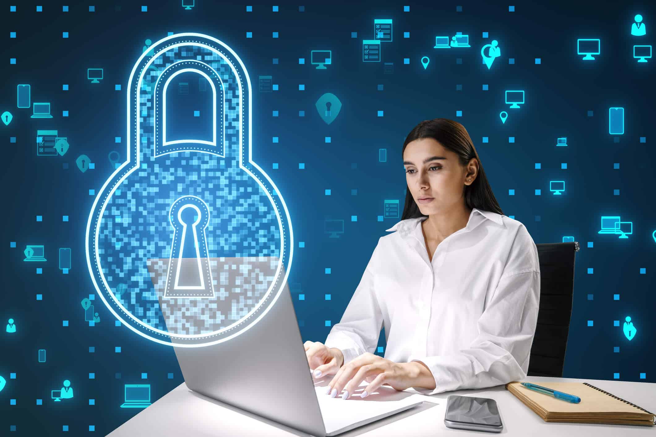 A woman working on a laptop beside a digital padlock representing data protection