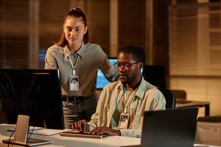 An IT security team conducting user access reviews and privilege assessments