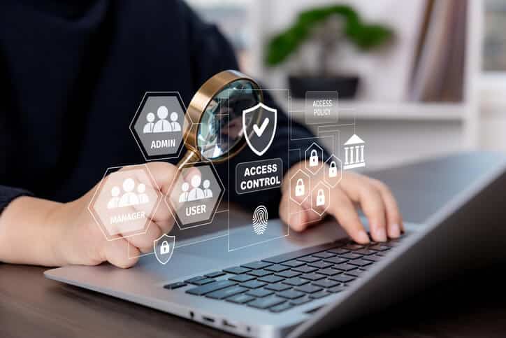A security analyst reviewing user permissions and access management policies