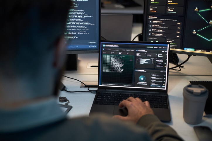 A cybersecurity professional monitoring systems during an incident investigation