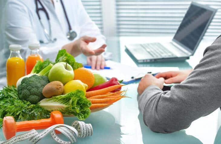 A nutritionist consulting with a patient after nutrition, health, and sports training
