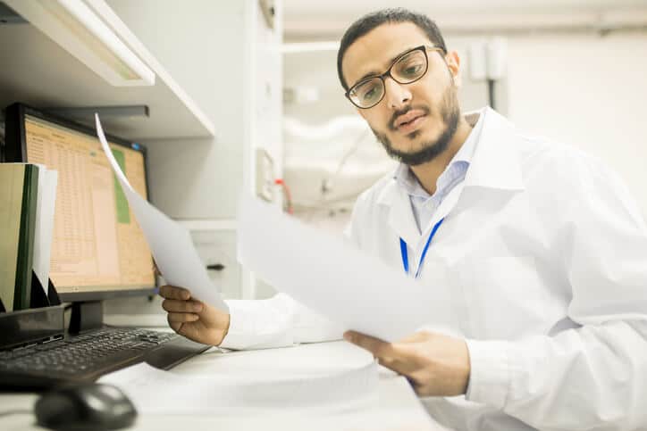 A quality assurance graduate working as a document reviewer in a pharma setting