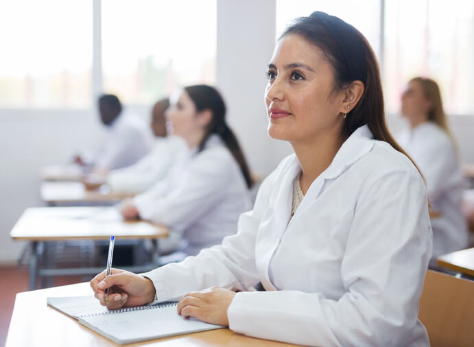 A student in a regulatory affairs training learning about NHP compliance