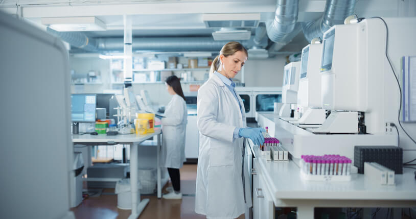 A female pharmaceutical industry professional working in a laboratory