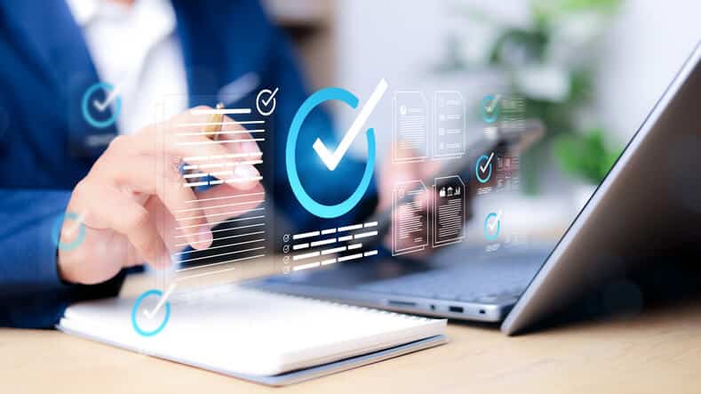 A pharmaceutical quality assurance professional reviewing GMP compliance documentation