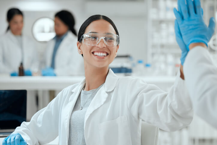 A female clinical research professional working in a laboratory after completing her training