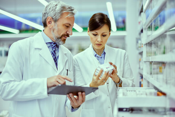 A regulatory affairs training professional checking the expiry date of health products