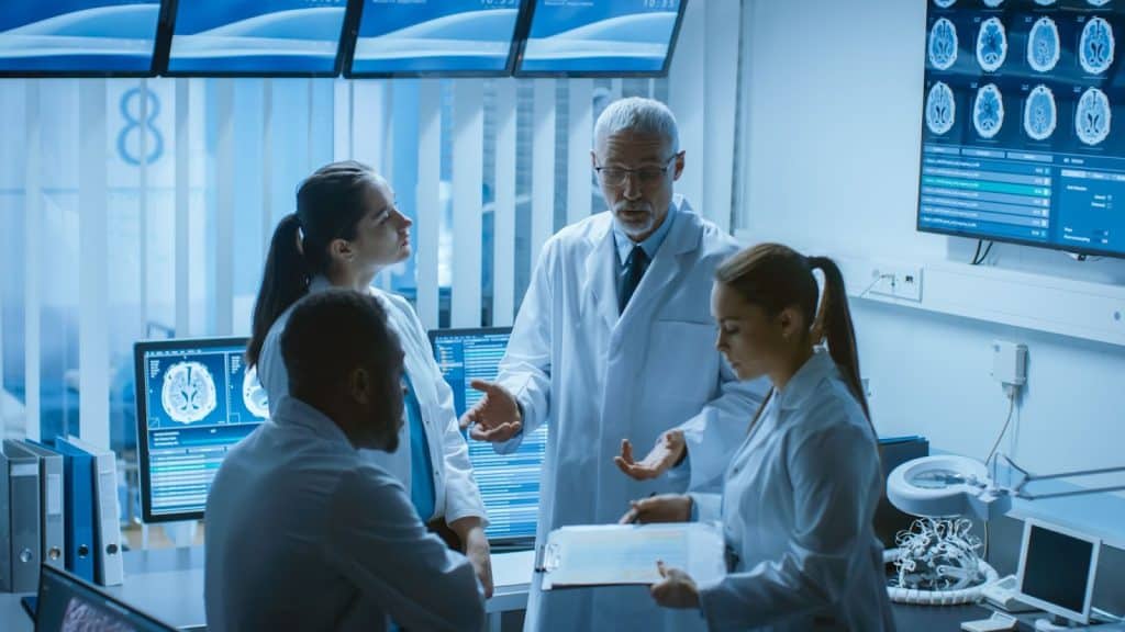 research team discussing clinical trial protocols and safety data