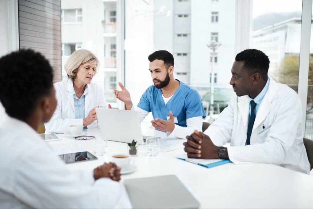 A clinical research team discussing a missed study visit and its potential impact