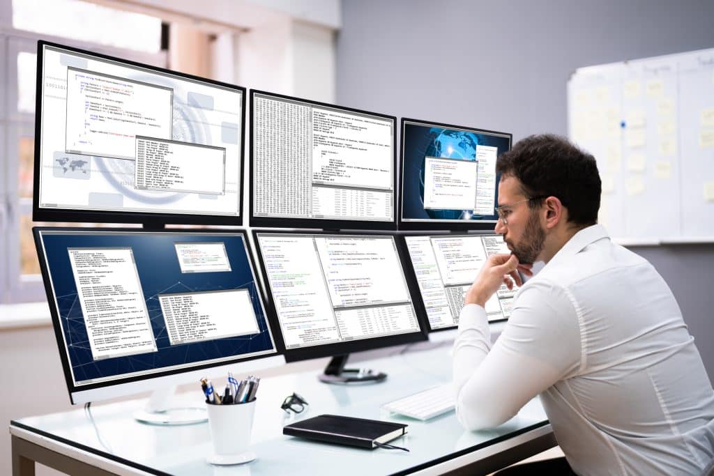 An analyst reviewing security logs to verify whether system safeguards are working