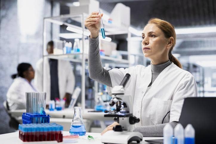 Quality control technician inspecting pharmaceutical samples
