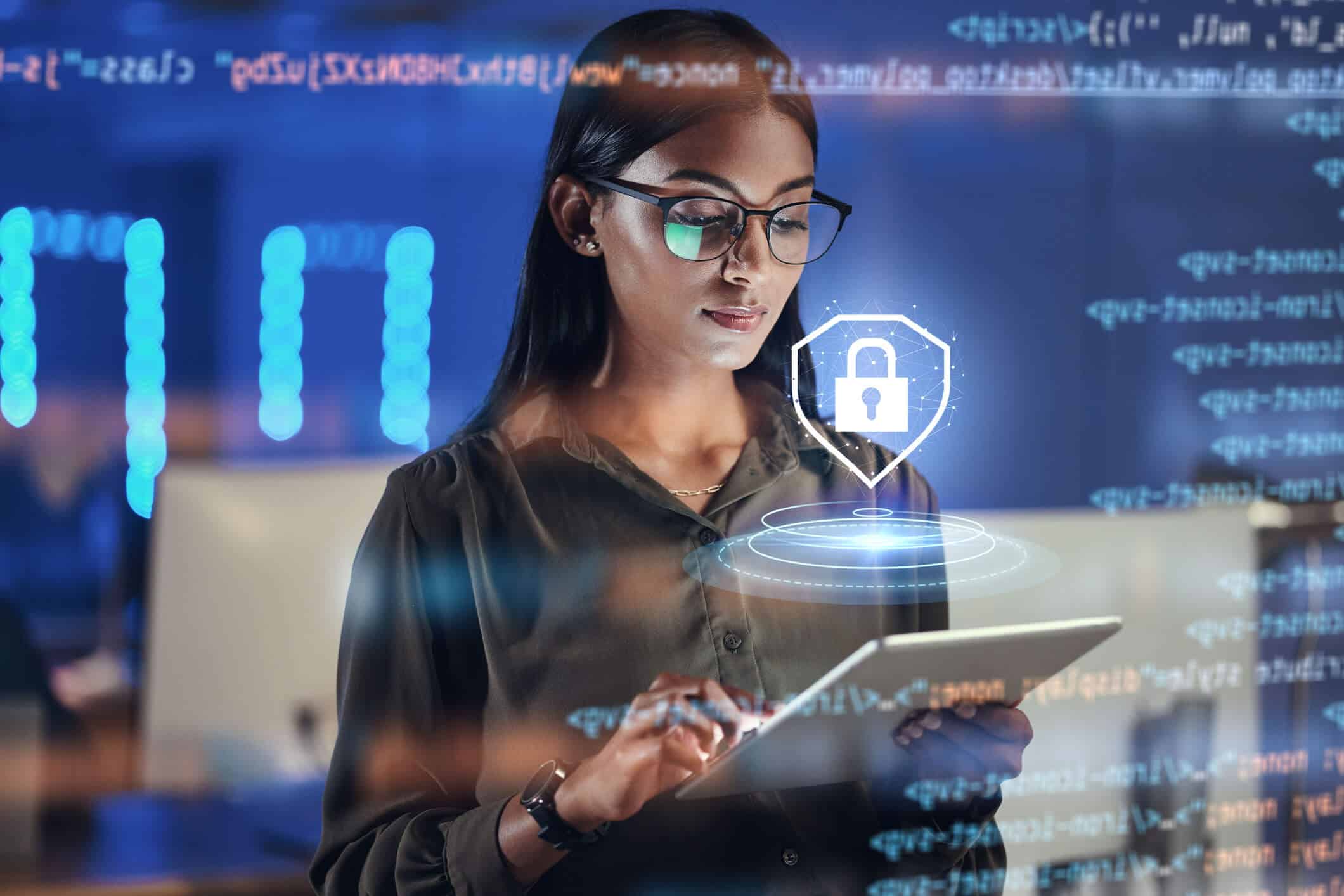 A woman using a tablet with a digital security shield and padlock graphic