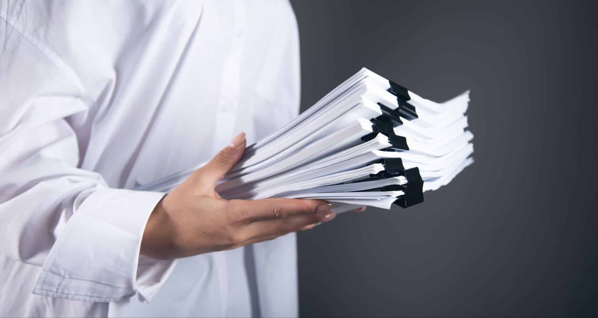 Clinical research professional organizing Trial Master File documentation