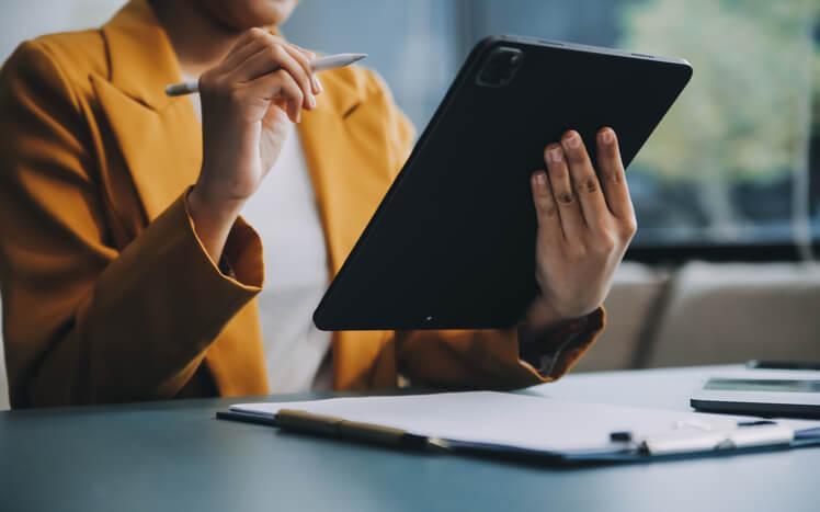 A focused female pharmaceutical professional taking pharma courses online